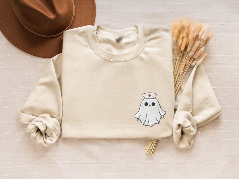 Embroidered nurse doctor ghost halloween sweatshirt in the colour sand
