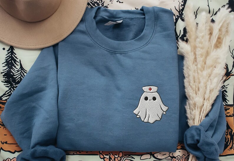 Embroidered nurse doctor ghost halloween sweatshirt in the colour indigo blue