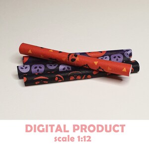 May include: A set of four miniature Halloween-themed paper straws, featuring a black and purple skull and crossbones pattern and a red and orange pumpkin pattern. The straws are designed for dollhouses or miniature scenes and are labeled "scale 1:12".