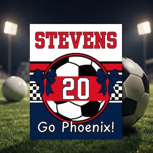 May include: A rectangular sign featuring the name STEVENS in red letters, a soccer ball graphic with the number 20, two dark blue bows, a checkered pattern, and the text Go Phoenix! in white against a red, white, and dark blue background.