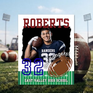 May include: A rectangular sports poster featuring a football player in a navy blue Rangers jersey with the number 32, holding a football. The text reads ROBERTS, 32, Go Rangers!, and EAST VALLEY HIGH SCHOOL on a green field graphic.