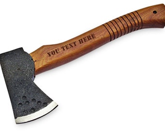 May include: A small, black axe with a wooden handle. The handle is engraved with the text "YOU TEXT HERE".