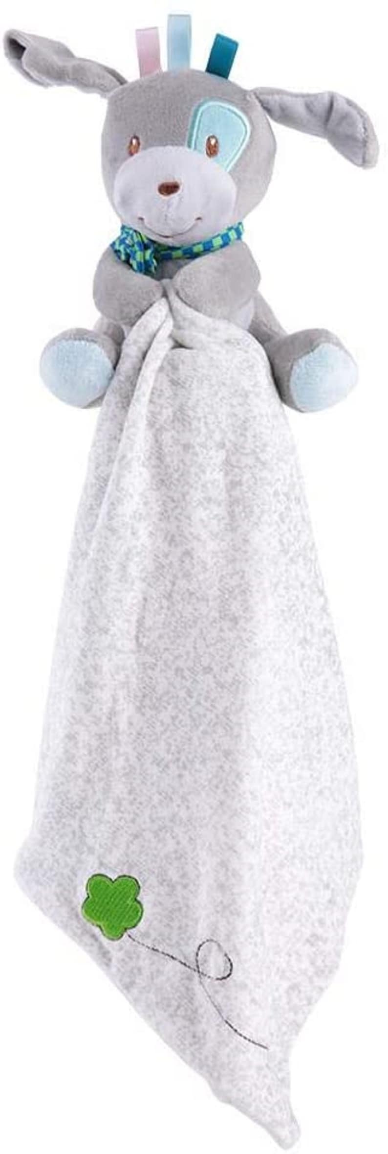 May include: A grey plush dog with blue eyes and a blue and green scarf holds a grey and white blanket with a green clover and a black swirl design.