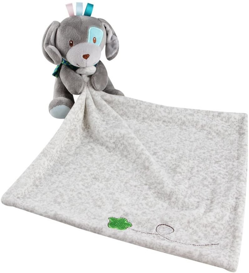 May include: A grey and white plush security blanket with a grey puppy attached. The puppy has blue eyes and a blue and green bow tie. The blanket has a green embroidered leaf and a black embroidered line.
