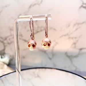 Pink Pearl Carved Skull Drop Earrings image 1