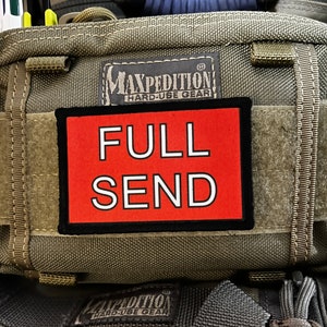 May include: A green Maxpedition Hard-Use Gear bag with a red patch that says "FULL SEND" in white letters.