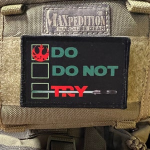 May include: A black patch with a white border and a rebel alliance symbol in red. The text "DO NOT TRY" is written in green and red.