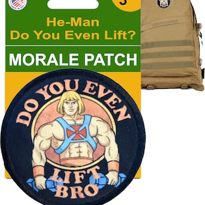 May include: A round, navy blue morale patch featuring a cartoon He-Man character with the text "Do You Even Lift?" and "Lift Bro." The patch is 3 inches in diameter and is displayed with a green and yellow backing.