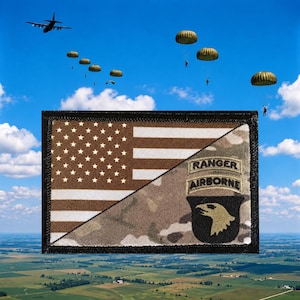 May include: A rectangular embroidered patch featuring a split design. The left side displays the American flag in brown and tan tones. The right side shows a camouflage pattern with the text RANGER AIRBORNE above a shield with an eagle head.