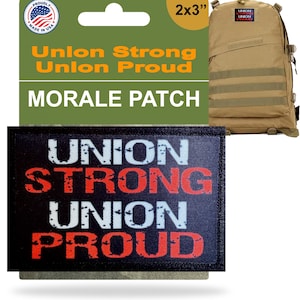 May include: A black and red morale patch with the words "UNION STRONG UNION PROUD" is displayed. The patch is 5.08 x 7.62 cm. A tan backpack with a matching patch is in the background. The packaging reads "Union Strong Union Proud".