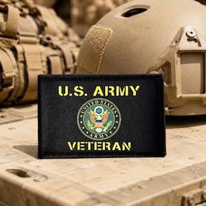 May include: A rectangular black patch featuring the yellow embroidered text U.S. ARMY at the top and VETERAN at the bottom. In the center is a circular emblem of the United States Army with a multicolored eagle, stars, and a shield design.