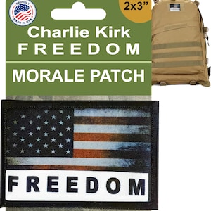 May include: A 2x3 inch morale patch featuring an American flag design with the word "FREEDOM" in white. The patch is displayed with a tan backpack. The packaging includes the text "Charlie Kirk FREEDOM MORALE PATCH".