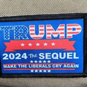 May include: A blue and red embroidered patch with the text "TRUMP 2024 The SEQUEL MAKE THE LIBERALS CRY AGAIN" and stars.