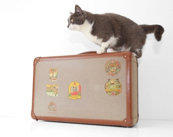 Vintage suitcase with travel labels 50s