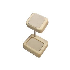 May include: A wooden jewellery display stand with two square platforms lined with beige felt. The stand is designed to hold rings, earrings, or other small jewellery items.