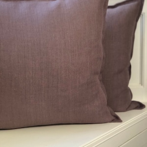 Vintage soft pink mauve linen cushion with edge detail