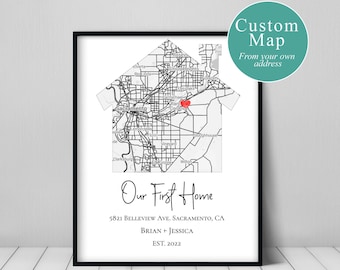 May include: A black and white map of a city in the shape of a house with a red dot marking a location. The text below the map reads "Our First Home", "5821 BELLEVIEW AVE. SACRAMENTO, CA", "BRIAN + JESSICA", and "EST. 2022".