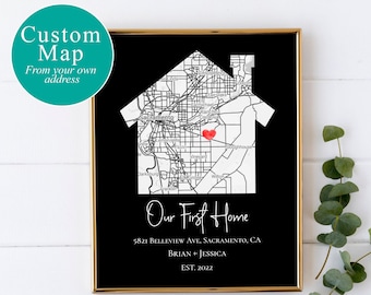 May include: A black and white map of Sacramento, California, shaped like a house, with a red heart marking a location. The text "Our First Home" is below the map, along with the address, "5821 Belleview Ave, Sacramento, CA", and the names "Brian + Jessica" and "EST. 2022".