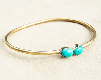 Open bangle with two turquoises handmade