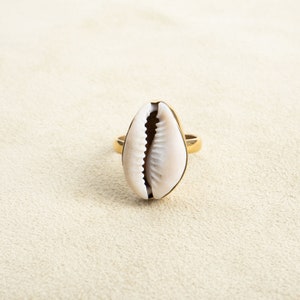 Large ring with cowrie shell made of brass gold handmade
