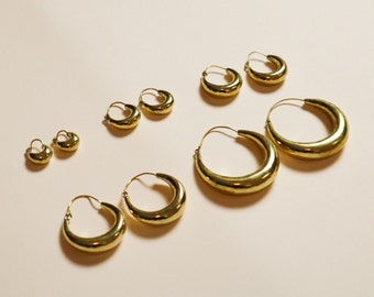 Wide chunky hoop earrings made of brass in various sizes gold