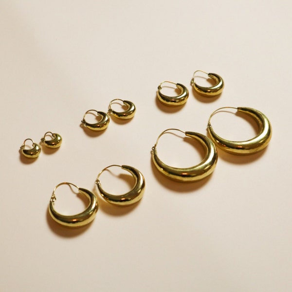 Wide chunky hoop earrings made of brass in various sizes gold