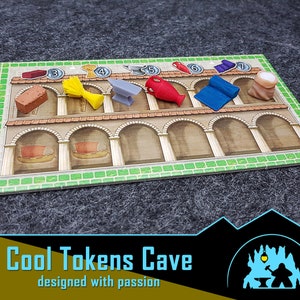 May include: A game board with a green background and a row of arches. There are seven small colored tokens on the board, each representing a different resource. The tokens are arranged in a row, with the numbers 3 through 7 printed above them.