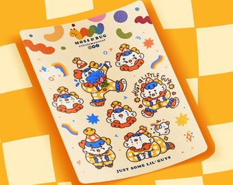 May include: A sheet of colourful stickers featuring cartoon clowns with different expressions. The stickers are on a yellow and white chequered background. The text on the stickers reads "Just a little gum" and "Just some lil' guys".