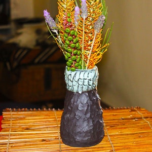 POTTERY vase in textured black clay with glazed interior