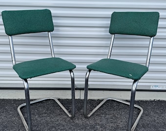 Vintage MCM retro tubular chrome cantilever green vinyl upholstered chairs retro pair