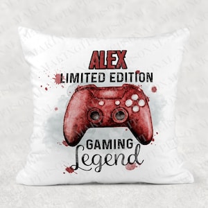 May include: White pillow with a red video game controller graphic and the text "Alex Limited Edition Gaming Legend".