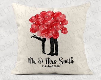 May include: A white pillow with a red heart balloon design and the text "Mr & Mrs Smith 21st April 2020".