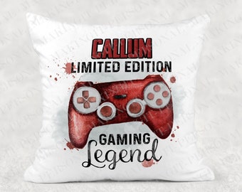 May include: White pillow with a red and white watercolor design of a video game controller. The text "CALLUM LIMITED EDITION GAMING Legend" is printed on the pillow.