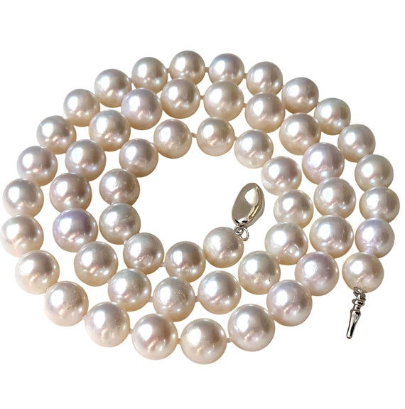 At Auction: Genuine coin pearls 20 inch necklace with 14kt gold clasp