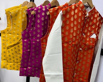 May include: Three sleeveless vests in yellow, purple, and orange with a white patterned design. The vests have a mandarin collar and button closure. A white long-sleeved shirt is also included.