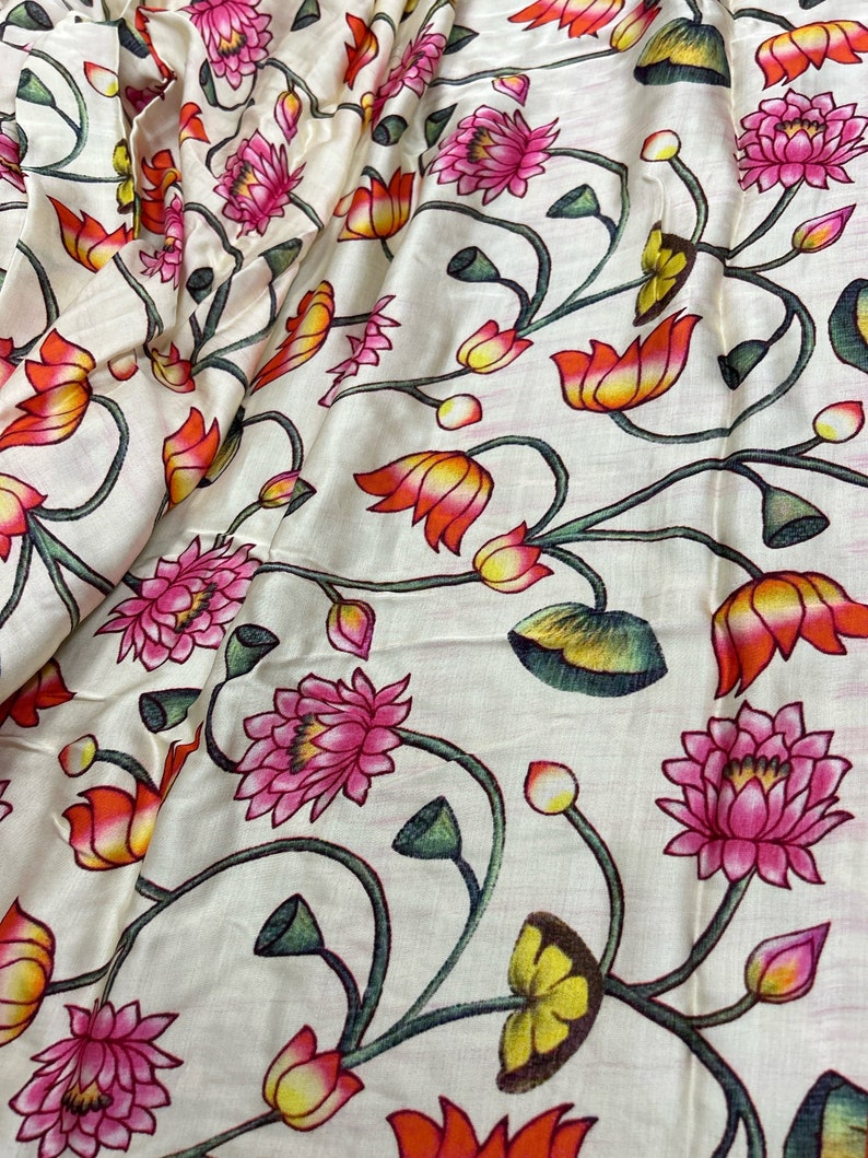 May include: White fabric with a repeating pattern of pink and orange lotus flowers with green stems and leaves.