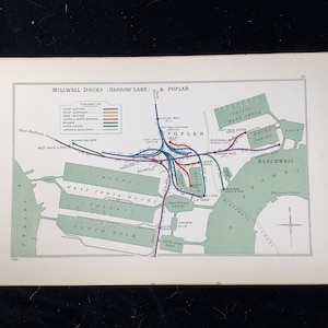 May include: A vintage map of Millwall Docks, Harrow Lane, and Poplar, featuring a detailed illustration of the area's layout. The map uses a color-coded system to denote different railway lines and dock areas, with text labels.