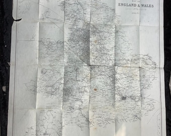 May include: Folded vintage map of England and Wales, featuring detailed black and white cartography. The map is creased and shows signs of age, with the title "LMS Map of England & Wales" visible. The paper has a slightly yellowed tone.
