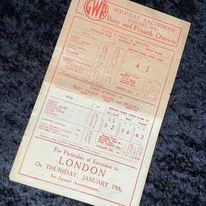 May include: A vintage train timetable for half-day excursions in the Barry and Penarth districts of Wales. The timetable lists departure times and fares for trips to Bristol, Port Talbot, Neath, and Swansea. The timetable is dated January 1939.