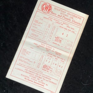 May include: A vintage train timetable for half-day excursions in the Barry and Penarth districts of Wales, UK. The timetable lists departure times and fares for trips to Bristol, Port Talbot, Neath, and Swansea. The timetable is dated October 1938.
