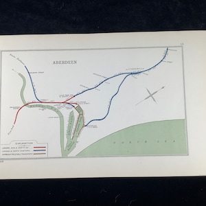 May include: A detailed vintage map of Aberdeen, Scotland, showing railway and tramway routes. The map uses red, blue, and brown lines to depict the network, with the North Sea and key locations labelled. The map is from 1918.