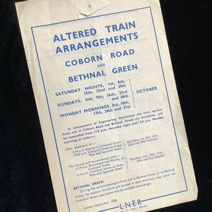 May include: A black and white informational poster with blue text detailing altered train arrangements for Coborn Road and Bethnal Green. The poster lists dates and times for service suspensions and re-commencements.
