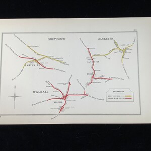 May include: A vintage map print featuring railway lines in red and yellow, with place names like Smethwick, Alcester, and Walsall. The map includes a compass rose and text indicating the Great Western and London, Midland & Scottish railways.