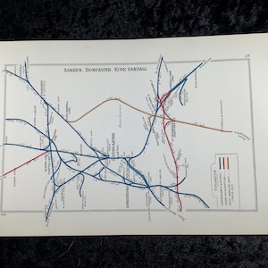 May include: Vintage map print featuring a detailed railway network in blue, red, and brown lines. The map includes the text "Askern, Doncaster, Kirk Sandall" at the top. The map is on a white background with a gray border.