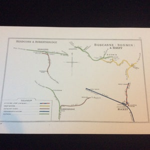 May include: A vintage map print featuring railway lines with place names like Headcorn & Robertsbridge, Boscarne, Bodmin & Haxey. The map uses a color-coded system to denote different railway lines. The print includes the date 1928.