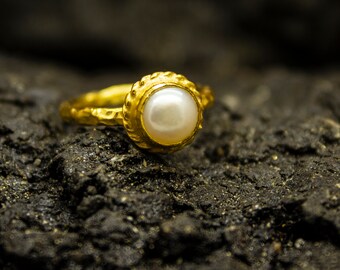 Gold mukta ring deals