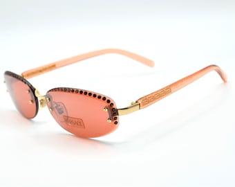 1990s Versace pink sunglasses women rimless oval X73