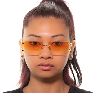 Ferragamo 1071 sunglasses, Y2K rimless frame with gradient orange lenses
