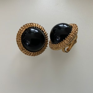 Vintage Trifari black and gold enamel clip earrings.