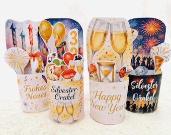 May include: Four New Year's Eve themed pop-up cards. Each card features festive illustrations of fireworks, champagne glasses, balloons, and the text "Frohes Neues", "Silvester Orakel", and "Happy New Year".